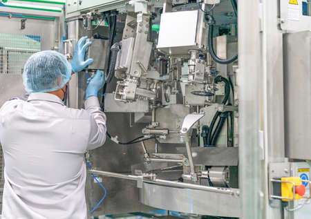 Engineer technician installation new machine in chicken meat process line. Poultry meat automatic process line.の写真素材