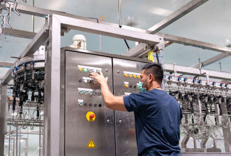 Automation Engineer Testing chain conveyor in chicken meat process line. Automatic Manufacturing Industry.の写真素材