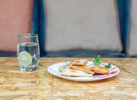 sandwich and lemon juice place on wooden table for breakfast.の写真素材