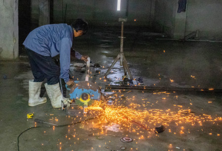 Worker use circle fiber cutting steel bar underground building. Construction concept.