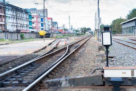 iron rusty train railway crossroads two ways detail over dark stonesの写真素材