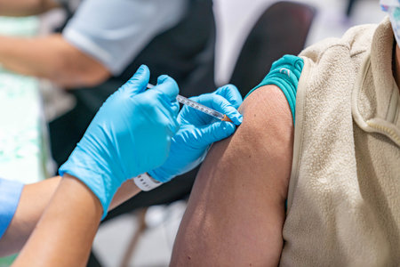 Woman with face mask getting vaccinated, coronavirus concept.