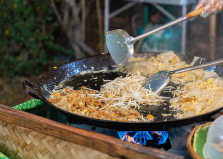 Chef cooking fried clams in big pan, Thai food, Street foodの写真素材