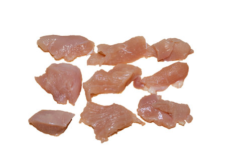 Raw chicken breast without skin isolated on white background. Multiple pieces of fresh chicken meat without skin. Top view.の写真素材