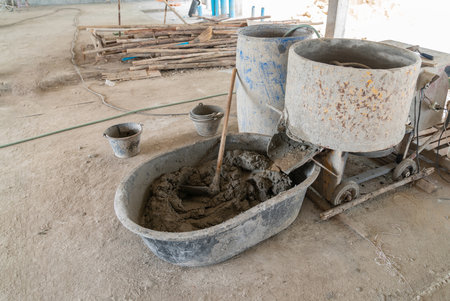 Mixing of wet mortar mixture for masionry brick work in construction.の写真素材