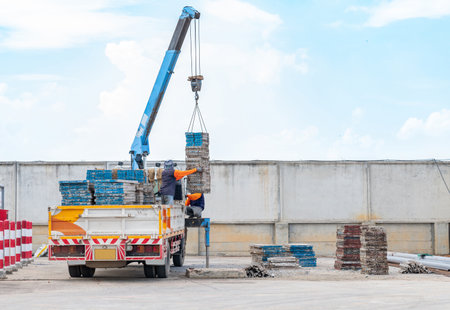 Mobile crane moving formwork at construction site.の写真素材