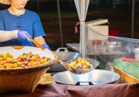 Cooking Sweet potato ball deep fried in hot pan, made from sweet potatoes and flour mold ball...