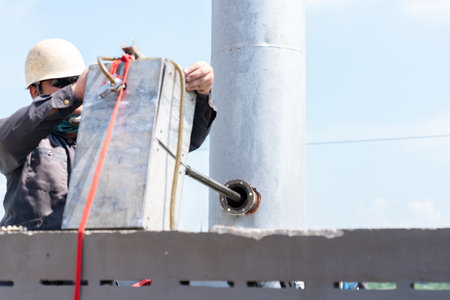 Environment officer install a monitoring on the boiler stack. Environment monitoring.