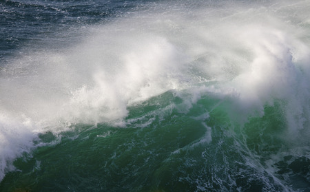 Powerful waves of Atlantic Ocean and stormy wind at Ponta de Sagres, South West of Portugal