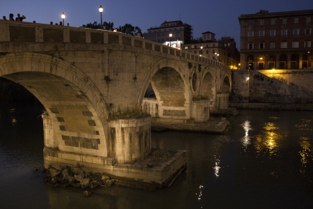 Beautiful bridge over the Tiber river, by nightの写真素材
