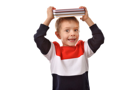 A boy with a book. School theme. Good mood.の写真素材