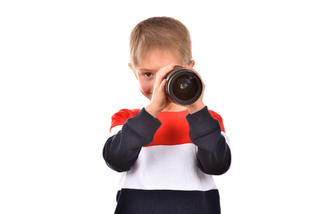 The boy is looking at the lens.の写真素材