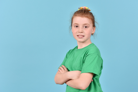 Portrait of a girl. A teenage girl on a blue background.の写真素材