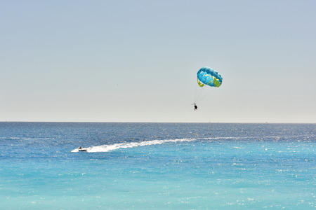 Recreation at sea. Tourist travel. Coast of the Mediterranean. Flying in a water parachute.の写真素材