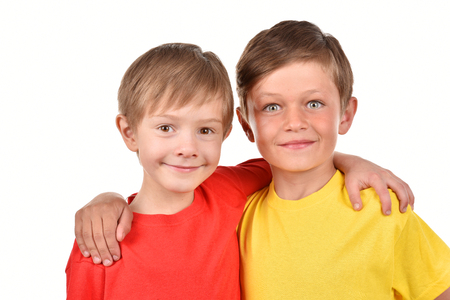 Funny children on a blue background. A strong friendship. Good mood. Two children.の写真素材