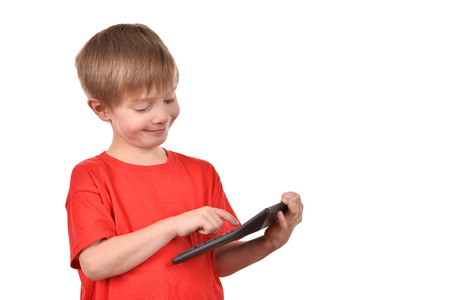 Boy with a calculator. A teenager is learning to count.の写真素材