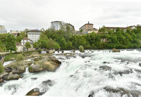 The Rhine Falls in Switzerland. A large stream of water.の写真素材