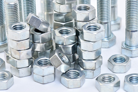 Fasteners on a white background. Manufacture of metal products.の写真素材