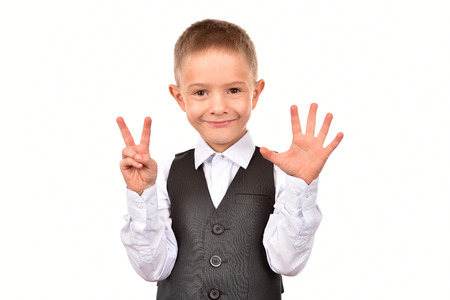 The boy is seven years old. The boy on a white background.