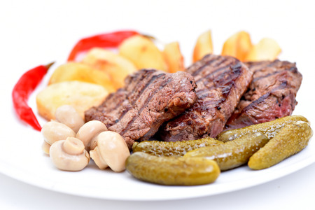 Meat dish. Delicious food. Steak with vegetables.の写真素材