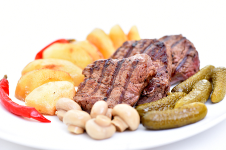 Meat dish. Delicious food. Steak with vegetables.の写真素材