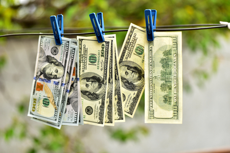 Dollars on clothespins. Good earnings. Cash flow.の写真素材