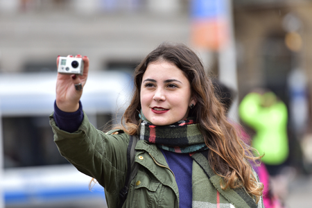 Netherlands Amsterdam 5 May 2018. A girl takes pictures of the streets of Paris.のeditorial素材