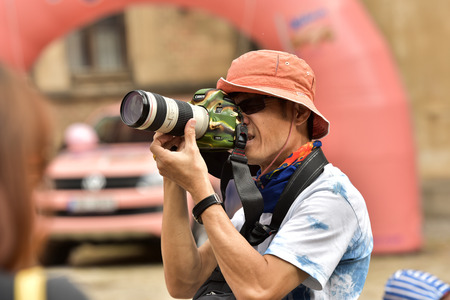 Czech Republic Prague June 26, 2018. Photographer on a city street.のeditorial素材