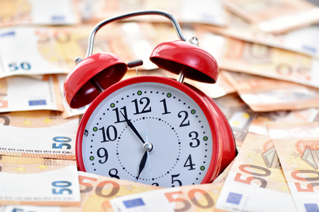 Time to make money. Alarm clock and euro.の写真素材
