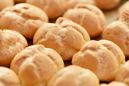 Hot baking tray of bread rolls. Flour products.の写真素材