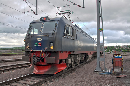 SWEDEN, KIRUNA  - FEBRUARY 10, 2012: Freight train of LKAB company carrying iron ore from mining town Kiruna situated beyond the polar circle.のeditorial素材