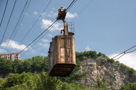 GEORGIA, CHIATURA - JULY 13, 2017: Old rusty cable way in mining town Chiatura coming to cableways central stationのeditorial素材