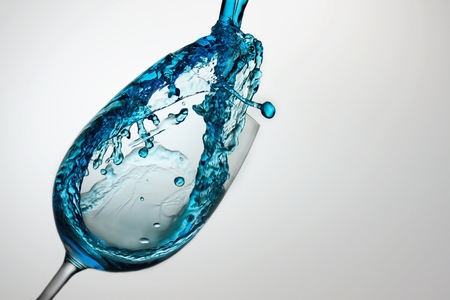 Blue splash from glassの写真素材