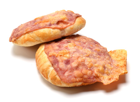 Baked bun with bacon and cheese on white backgroundの写真素材