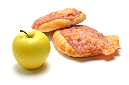Baked bun with bacon, cheese and green apple on a white backgroundの写真素材