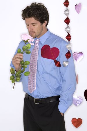attractive man wearing formal blue shirt and black pants during valentines dayの写真素材