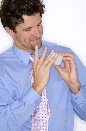 attractive man wearing formal blue shirt and black pants during valentines dayの写真素材