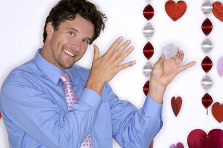 attractive man wearing formal blue shirt and black pants during valentines dayの写真素材