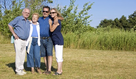 happy two older couples posing in the summer