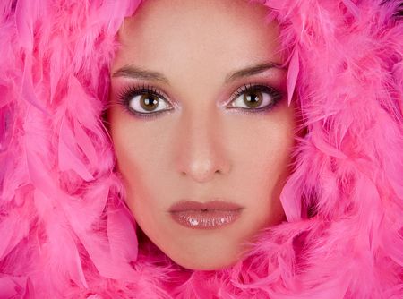 pretty model with bright makeup wearing pink boaの写真素材