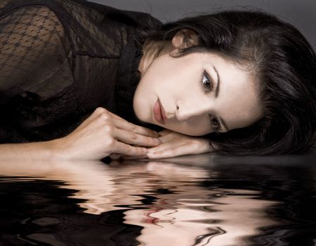 sexy pretty woman wearing couture outfit on darkの写真素材