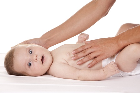 baby girl smiling, female arms holding her bodyの写真素材