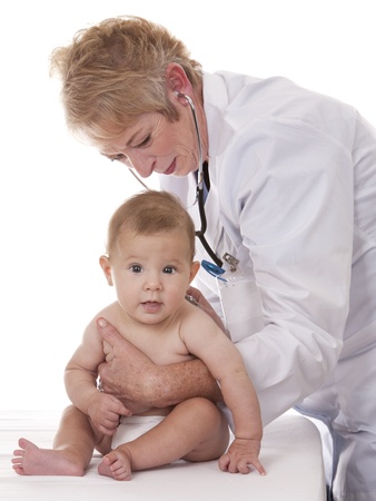 female doctor checking a baby on white isolated backgroundの写真素材