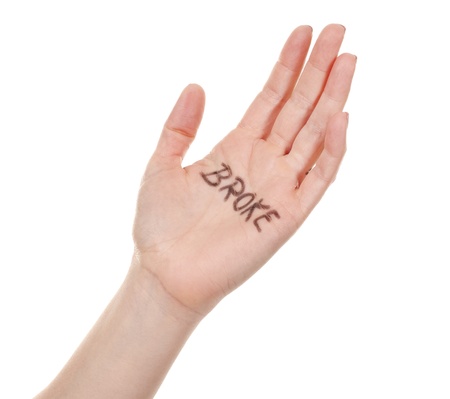 female hand on white isolated background with written messageの写真素材