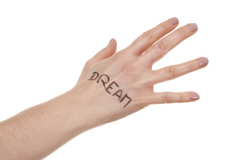 female hand on white isolated background with written messageの写真素材