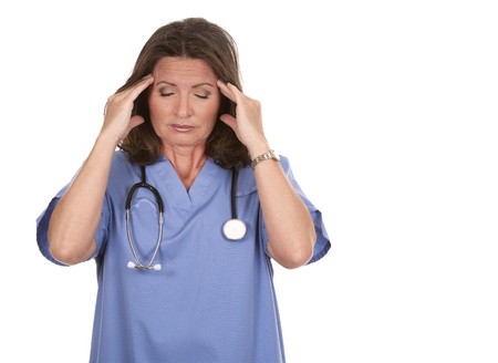 female nurse wearing scrubs on white isolated backgroundの写真素材