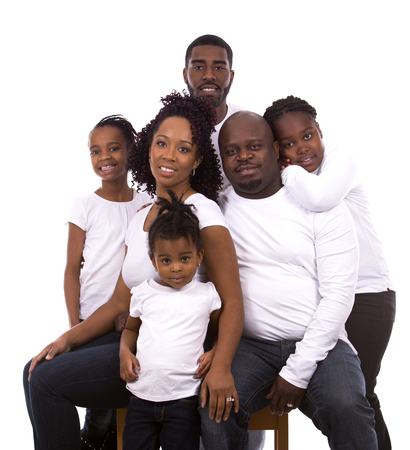 casual young black family on white isolated backgroundの写真素材