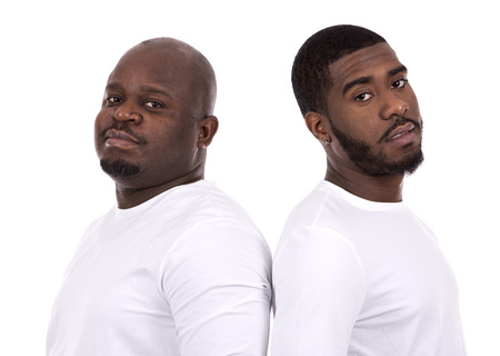 casual black man with son on white studio background