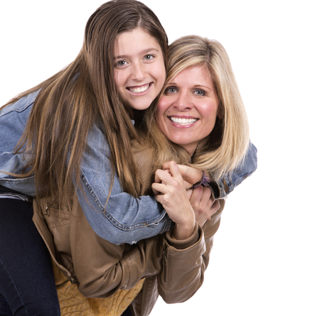 caucasian mother and daughter on white studio backgroundの写真素材