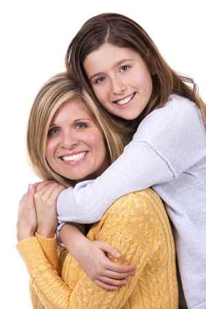 caucasian mother and daughter on white studio backgroundの写真素材